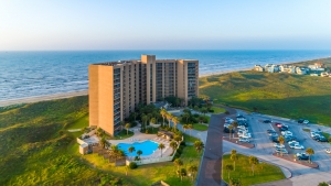 Aerial view of Sandpiper Condominiums and ocean view